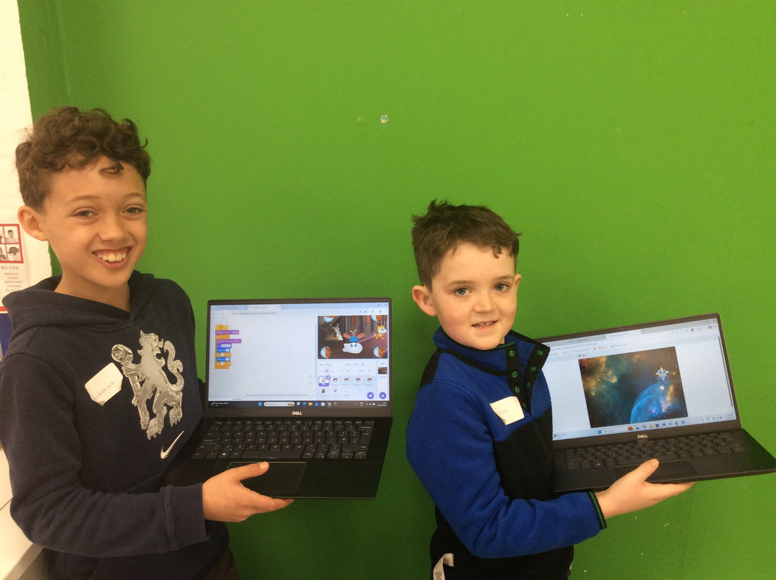 Child coding a game in Scratch at a BetaGen after-school coding club.