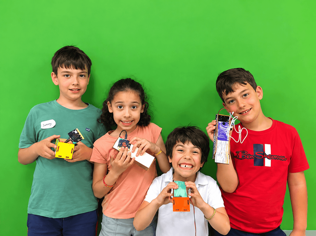 Children aged 7–9 coding robots at a BetaGen holiday camp in Notting Hill